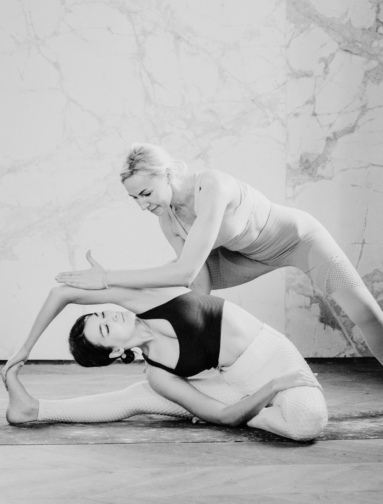 Instructor guiding functional movement and yoga stretch to improve mobility and stability.